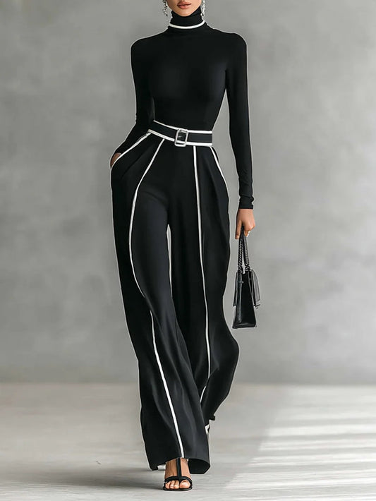 Conjunto: compuesto por un top de cuello alto y manga larga con ribete blanco, pantalones de pierna ancha y cinturón